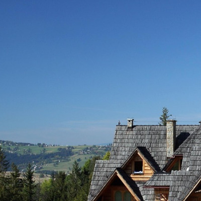 roofing contractor crew shingles house
